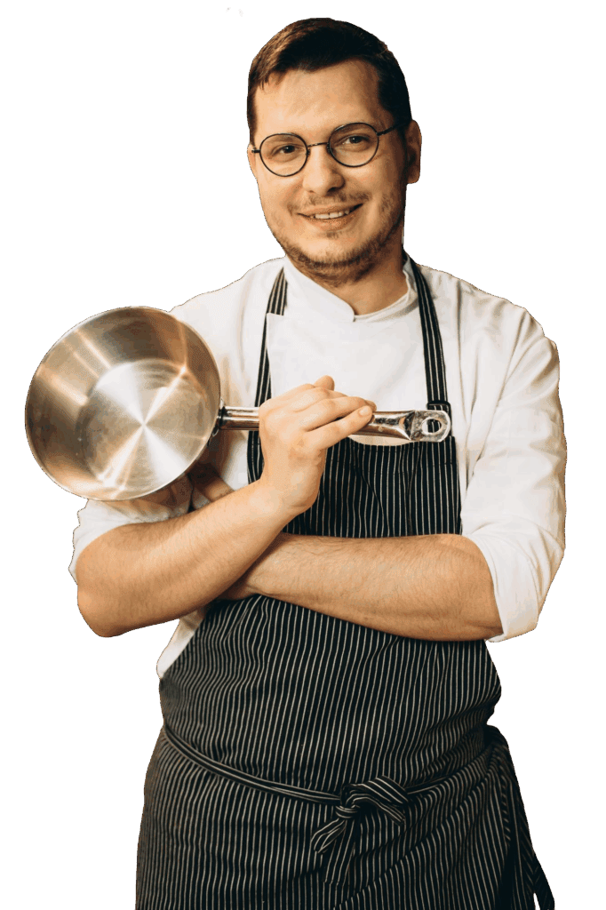 male chef kitchen holding frying pan