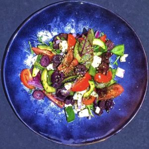 Greek salad, on blue plate, catering, wedding
